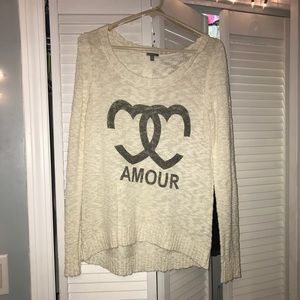 Cream, light sweater.